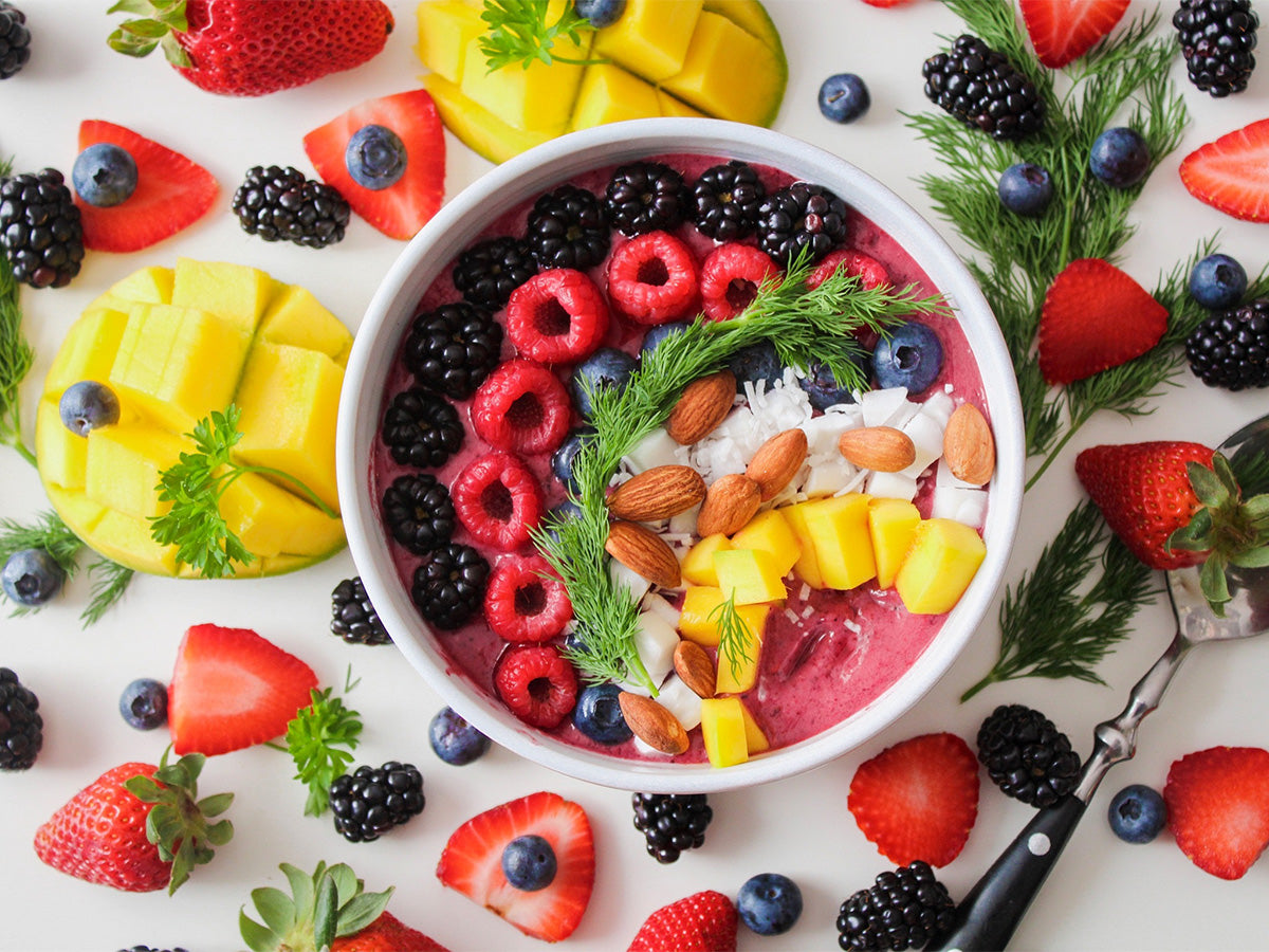 bowl of nuts fruits vegetables that promote a healthy gut microbiome